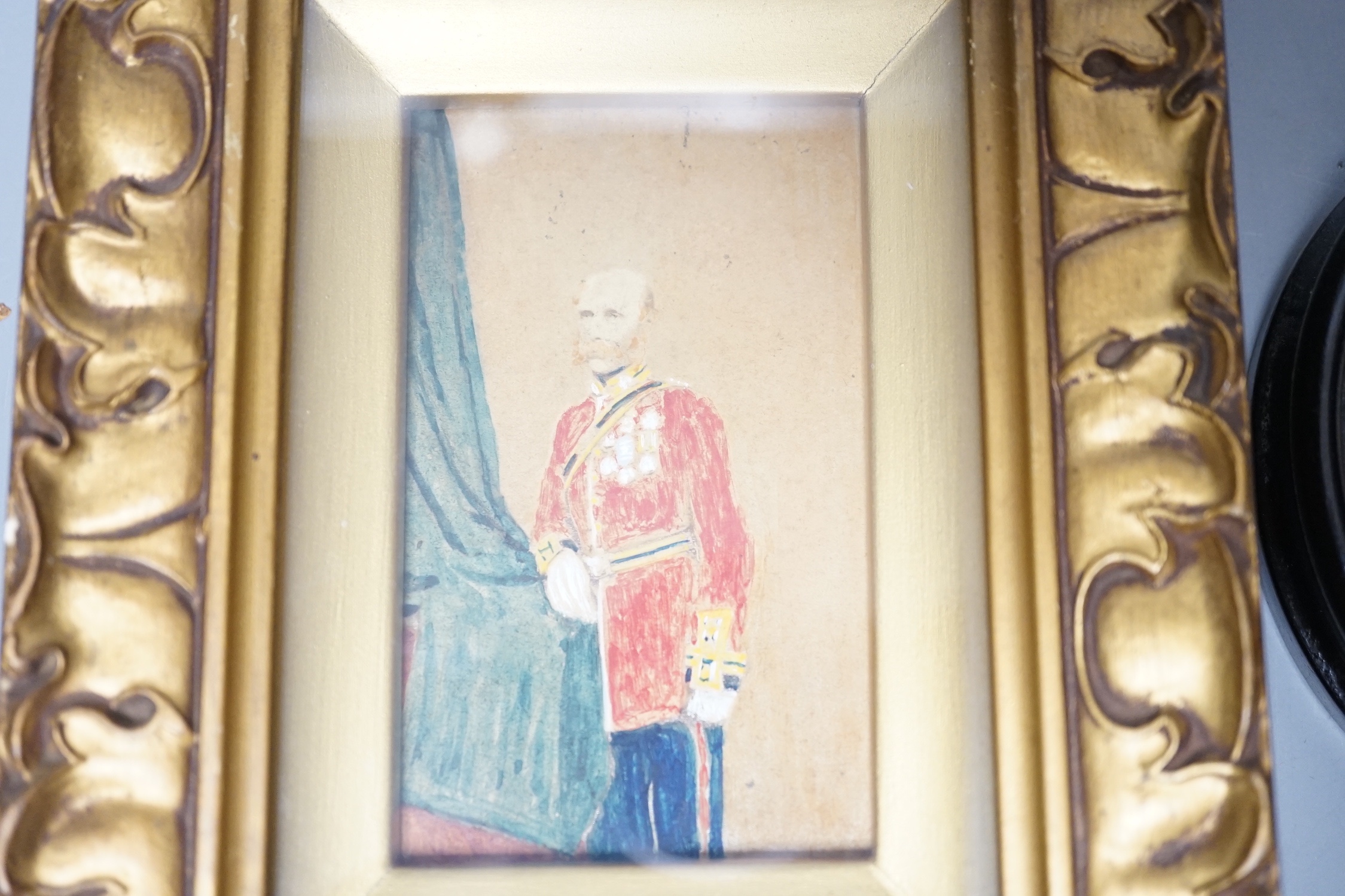 A 19th century portrait miniature on ivory of a gentleman in oval frame, 9.5cm and an overpainted photographic portrait (2)